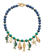 Turquoise and blue sponge coral beaded statement necklace laid flat, with enamel fish, shell and starfish charms and a gold toggle clasp