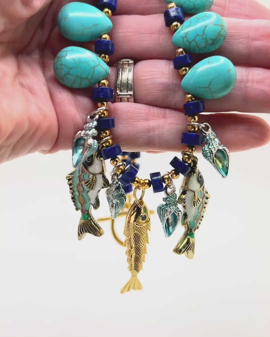Load video: Turquoise Howlite Faux Lapis Fish Charm Necklace